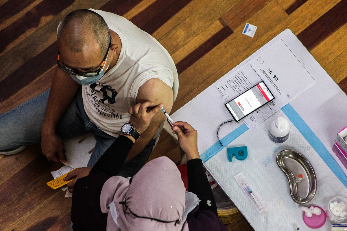 Based on the government’s target of having 80% of the population fully vaccinated against Covid-19 to achieve herd immunity, the country will need to have about 26 million people completing their two-dose vaccination. (Photo by Zahid Izzani Mohd Said/The Edge)